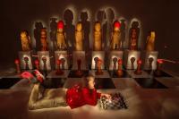 A large chess board with life-size pieces is posing questions about gender roles and hierarchy