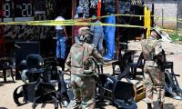 Manhunt launched after 13 men and four women killed in South Africa: Eight gunmen armed with 'AK-47 rifles and pistols' open fire at bar