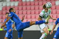 Ireland players wear black armbands and refrain from handshakes in soccer game against Israel