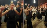 Dua Lipa is hailed an 'Albanian queen' as she perfectly balances a glass on her head while performing a traditional dance with her dad at a family wedding in Prishtina