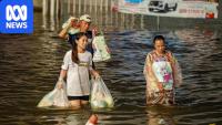 Bangkok locals rally to help each other as flood wreaks havoc