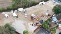 Travellers bulldozed over our village field & built 10ft fence… now cops are escorting caravans & acting like bodyguards