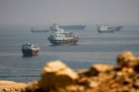 Iran touts Hormuz attacks as oil flows increase despite tensions