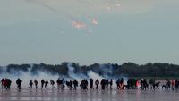 French police fire tear gas at migrants on beach