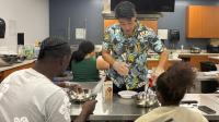 City College students get hands-on with poke bowls for Hawaiian History Month