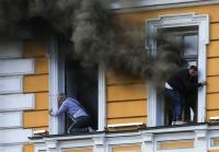 Ukrainians escape on ladders from burning research center after Russia attack
