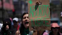 Protesters march for unrestricted abortion access in Chile and Colombia
