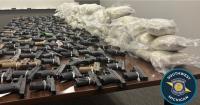 Michigan semi stop uncovers 368 pounds of suspected heroin, 174 handguns