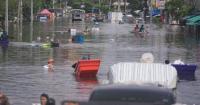 Bangkok suburbs endure daily struggle as floodwaters linger