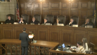 Justices consider appeal in challenge to Nebraska overseas voter law
