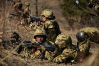 North Korean soldiers cut winter firewood for their units and their officers’ homes