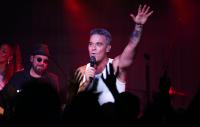 Watch Robbie Williams surprise fans with impromptu street performance in Buenos Aires