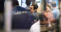 Wall Street swirls after data show inflation isn't as bad as thought, while the US economy is better