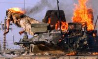 From Saddam's execution to the rise and fall of ISIS: Stunning images illustrate America's two decades in Iraq as final US troops leave today
