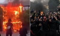 'Student' riots rock France as masked men torch schools and douse teachers in petrol 