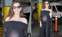 Pregnant Anne Hathaway glows as she shows off her baby bump in a sheer top during New York City press day