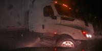 Watch: Nebraska driver narrowly avoids jackknifing semi-truck as pouring rain fuels flood threat in the Plains