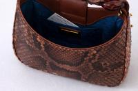 Small business owner turns invasive Everglades pythons into luxury handbags