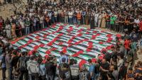 U.S. deploys another carrier to the Middle East; Putin escalates Kaliningrad threats; Mass funeral in Gaza