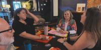 Community members learn a new language and culture