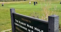England's oldest 9-hole golf course in Northumberland with a road cutting through it