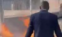 Left-wing Parisian mayor joins in the riots convulsing France - as firefighter is set alight and protesters threaten to burn down the Elysee Palace