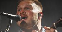 Zach Bryan wears "Free Palestine" shirt during concert at Gillette Stadium
