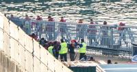 ‘Patriots’ leave nails in front of police at anti-migrant protest as boat carrying 120 lands in UK