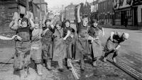 A policeman directs traffic from a metal bin, Harrow boys queue for sweets in straw boaters, and men on stilts tend the Kent hops: new photo book opens a fascinating window on 1930s Britain