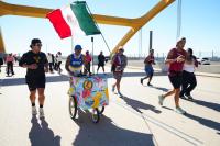 Milwaukee man running 26.2 miles with a 'paleta cart' sets unofficial world record