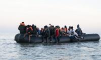 Two men dead and two women severely burned following fire on overcrowded mega-dinghy heading for Britain from France