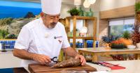 Spanish chef Karlos Arguiñano demonstrates his technique for peeling yuca, and Latino fans react with humor