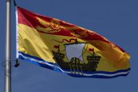 U.S. officials allow liquor deliveries to resume to isolated New Brunswick island.