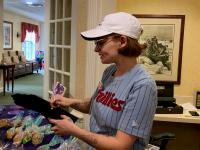 Shannondell Memory Care activities director working on songbook for music therapy
