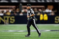 NFL suspends an official two games for cursing at Arizona tight end Trey McBride