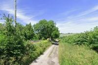 Travellers seek change of use consent for paddock to accommodate four mobile home pitches within a short distance of close relatives