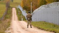 Aggressive armed escorts from Belarus tried to push illegal migrants into Latvia