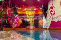 Neon, beach-themed cannabis dispensary opens in RiNo