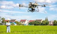 China deploys more smart drones, intelligent harvesters for autumn farming