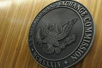 SEC spares fund giants charges but warns on Exxon climate campaign