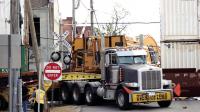 Train hits semi-truck pulling trailer