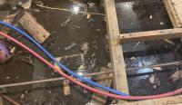 Texas homeowners paid for sump pumps and drains, then rain left inches of water under house