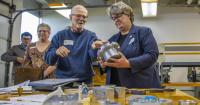 State pays a visit; education boss gets an up-close look at student-run program