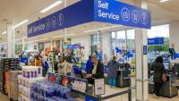 Tesco raises profit forecast and lifts share buyback to £950m