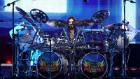 80s rock legends rush drummer offstage mid-set after he suffers medical emergency during gig