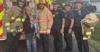 Kansas firefighters rescue pet iguana stuck in tree