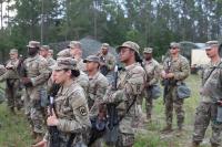 U.S. Army soldiers stand in formation during field...
