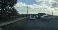Junction One Retail Park Road closed by police with queues backing up to Wallasey