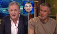 Jamie Carragher and Piers Morgan trade insults on social media as Liverpool legend brands broadcaster an 'absolute phoney' over his staunch defence of Cristiano Ronaldo