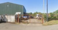 Storage building approved despite 16 objections as site condition criticised